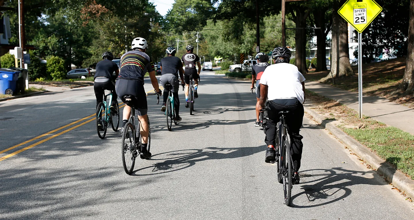 Riding at the back of a group, looking forward seeing road bikers in front of you.