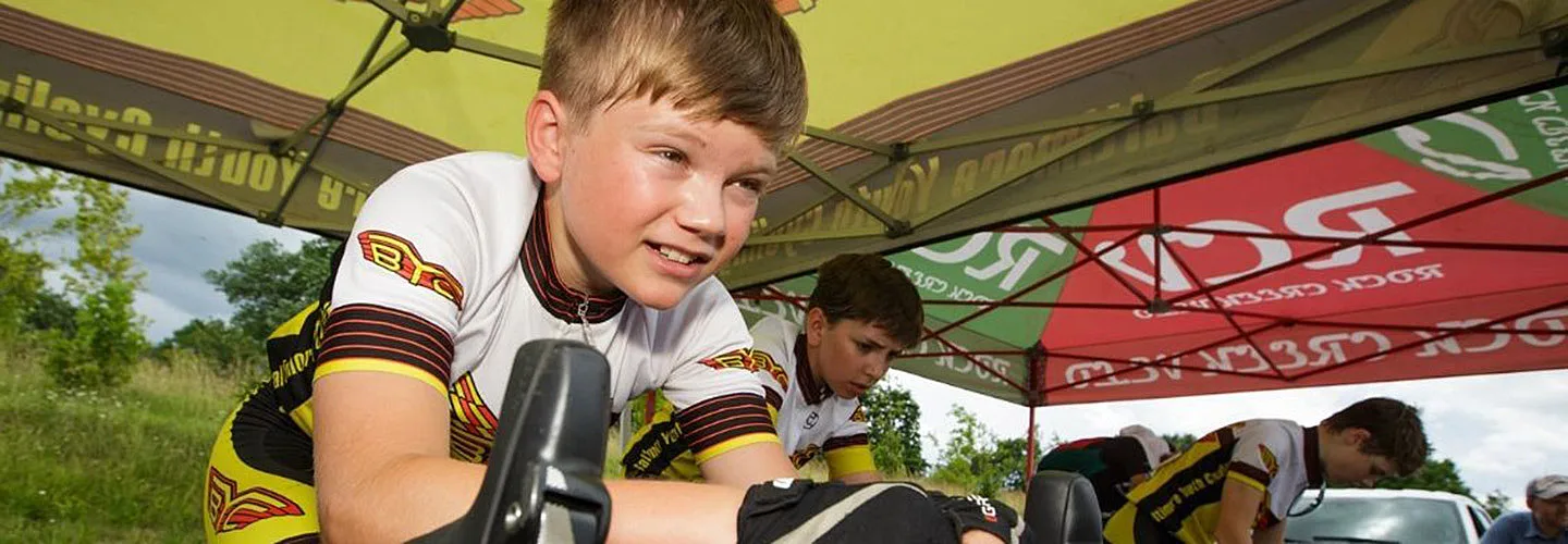 Junior racer on a watt bike before a race.