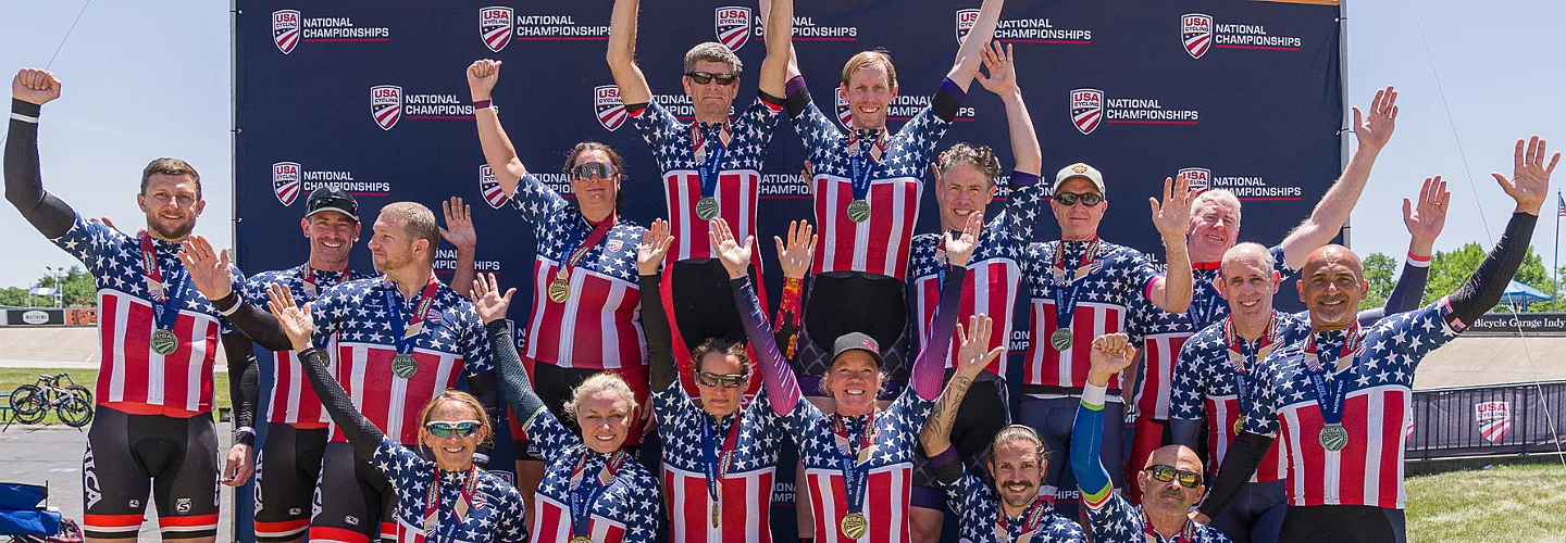 Group of cyclists celebrating on the podium.