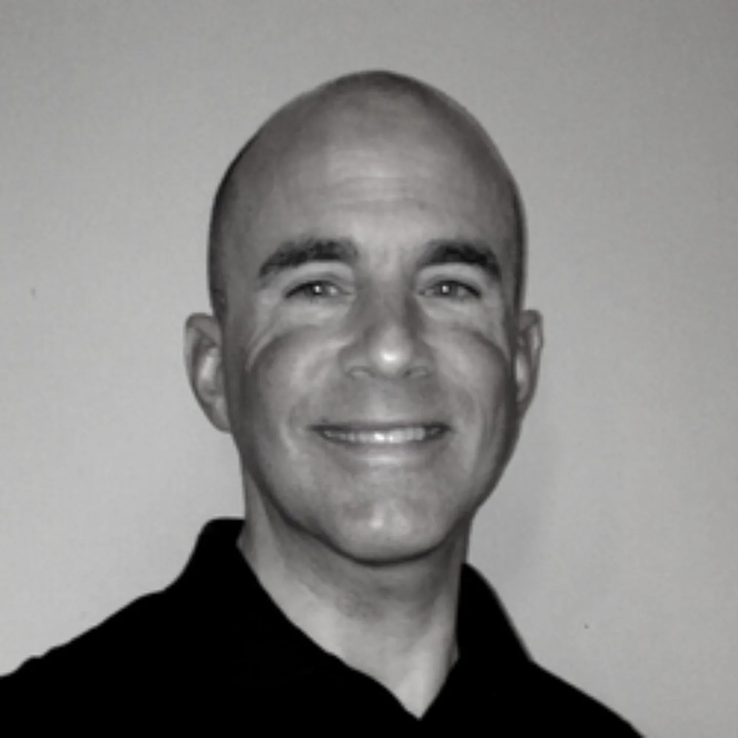 Michael Cole smiling for a photo.