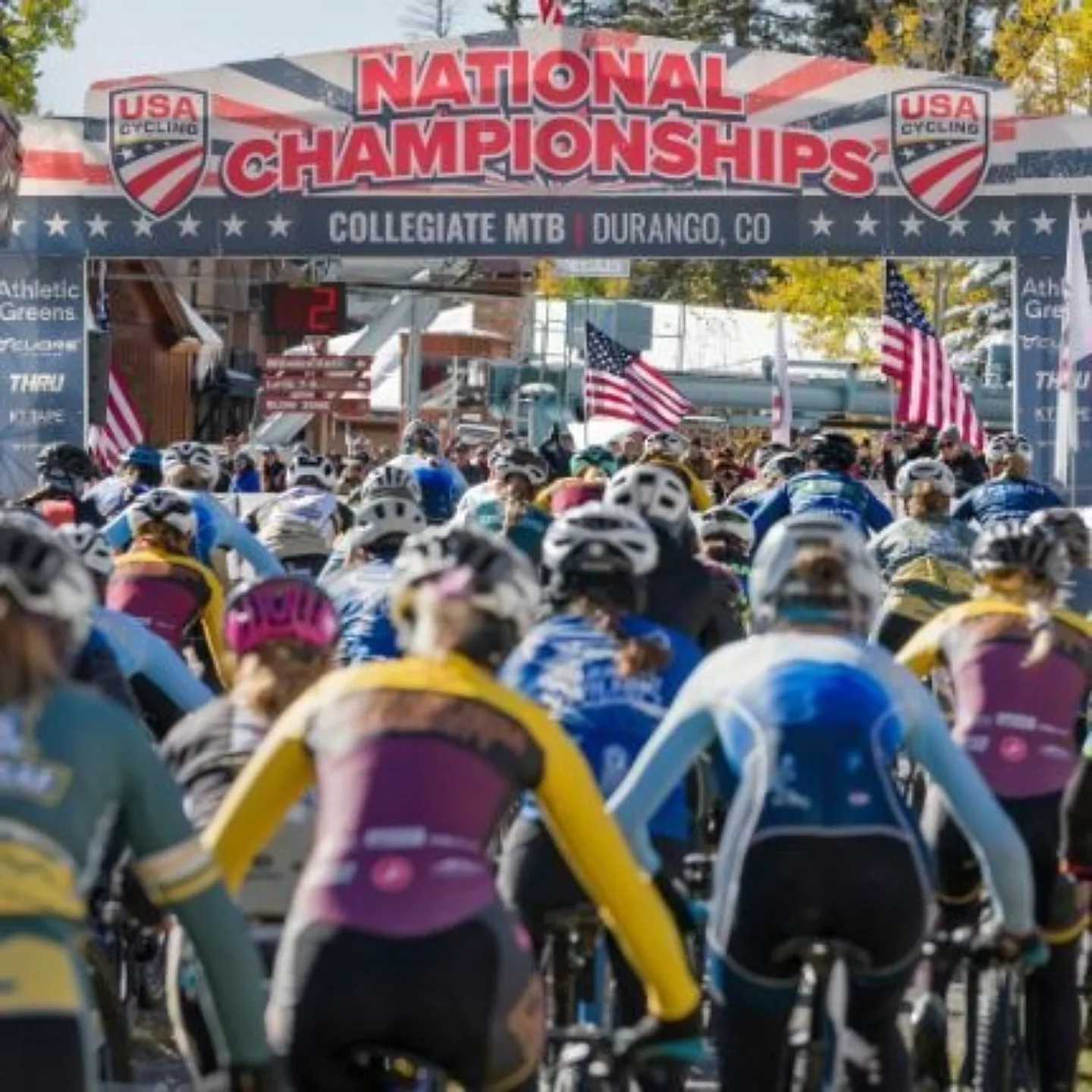 Large group of bike racers at the starting line of a race