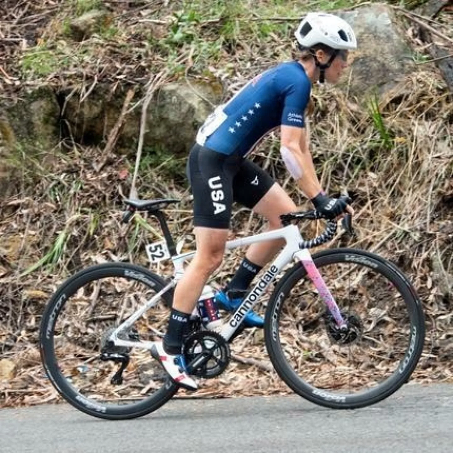 Road racer biking uphill.