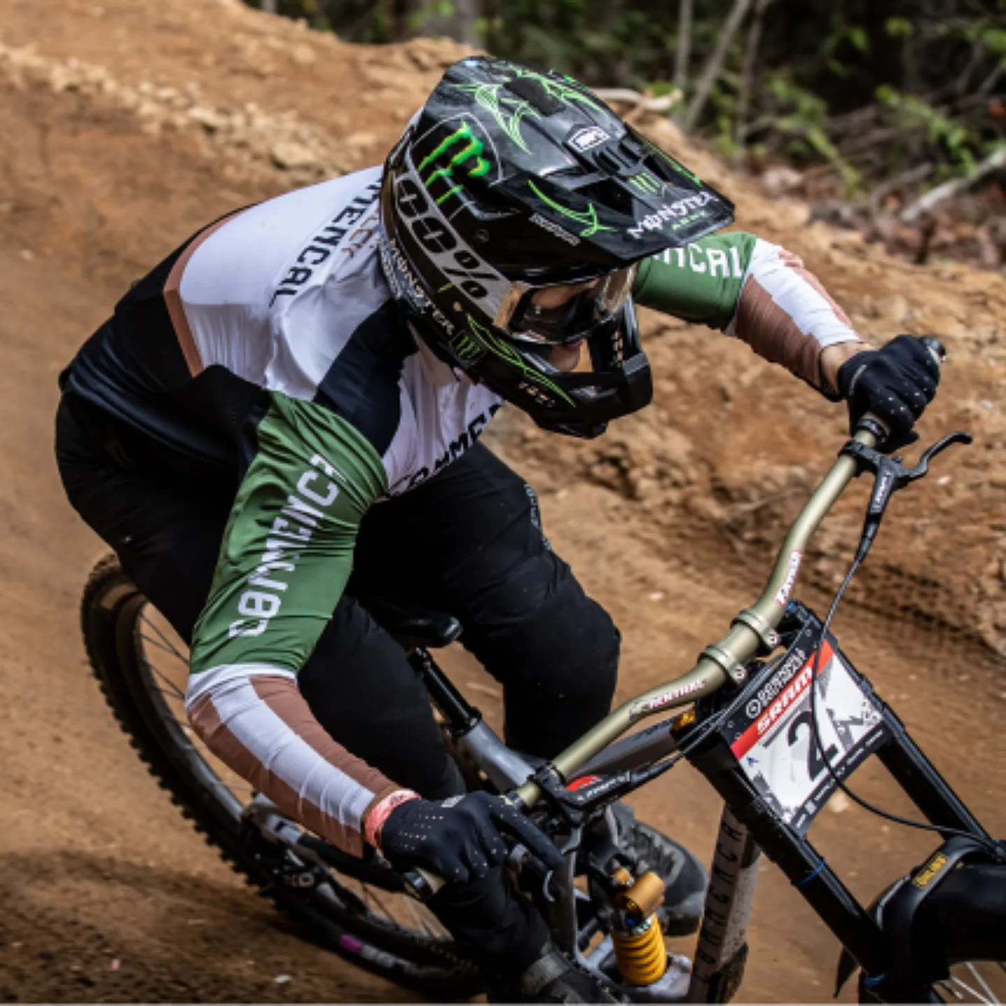 A downhill mountain bike racer riding down the mountain