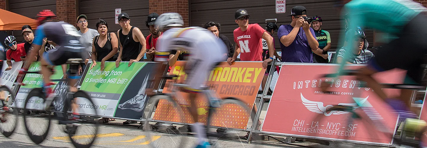 Photo of racers, zooming by blurred.