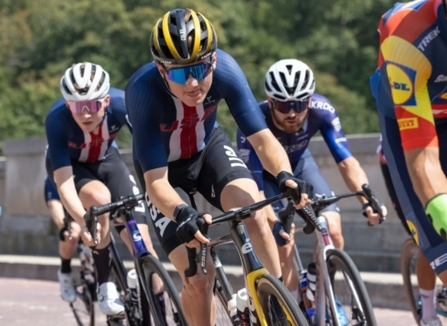 Road racers mid race. Donate to USA Cycling | Support USA Cycling | USA Cycling Foundation. USA Cycling is a non-profit organization accepting tax-deductible donations.    The USA Cycling Foundation is a non-profit arm of USAC that raises money for several different programs and initiatives. Donate, join our foundation, or purchase cycling gear today!