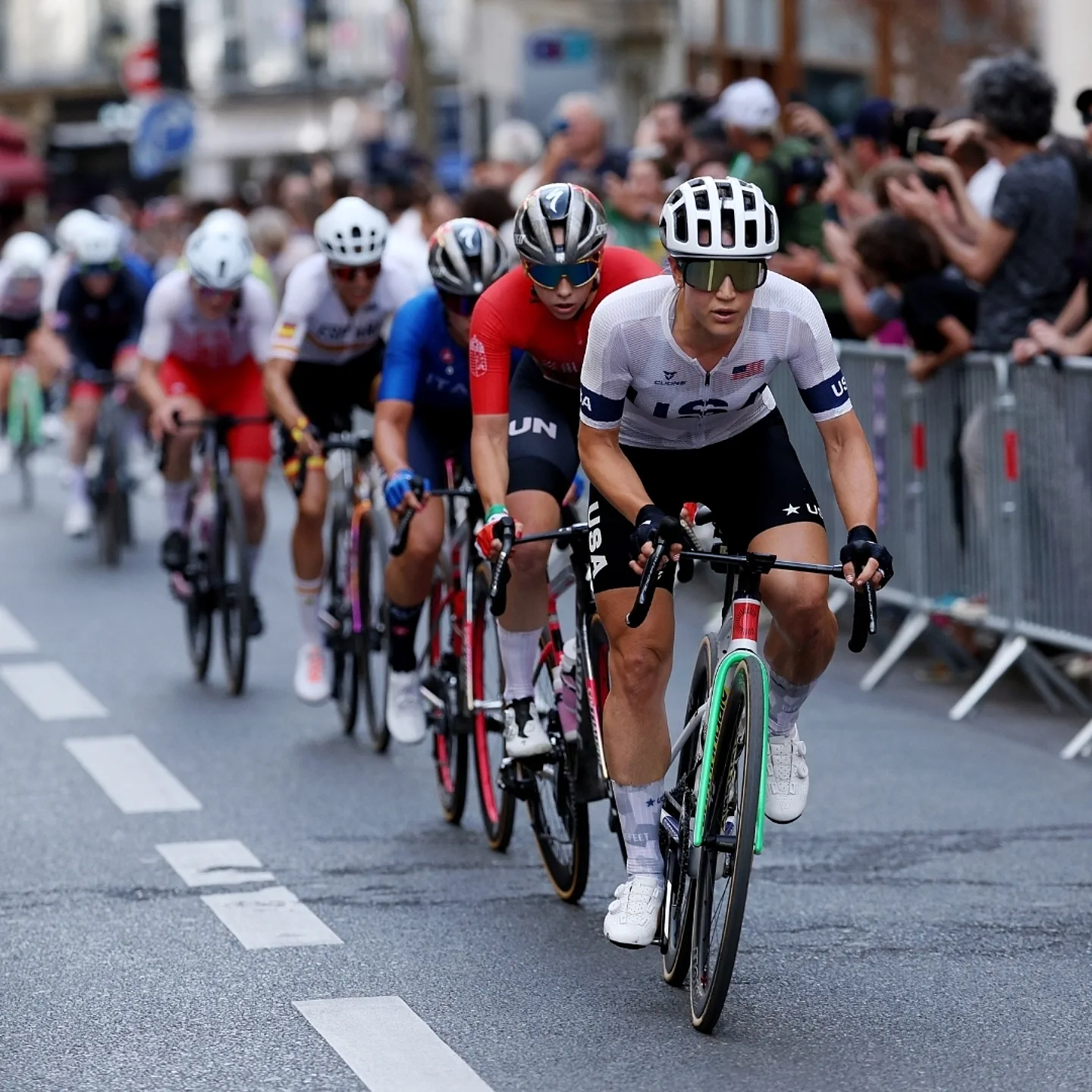 Kristen Faulkner leading a pack of road racers.