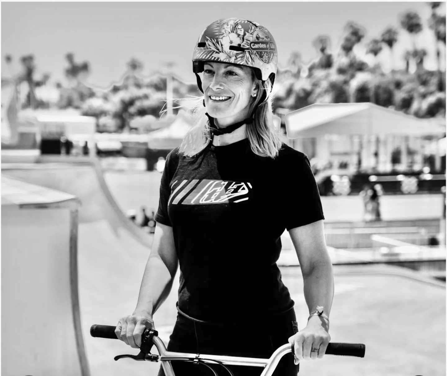 Cory Coffey holding the handlebars of a BMX bike at the skate park