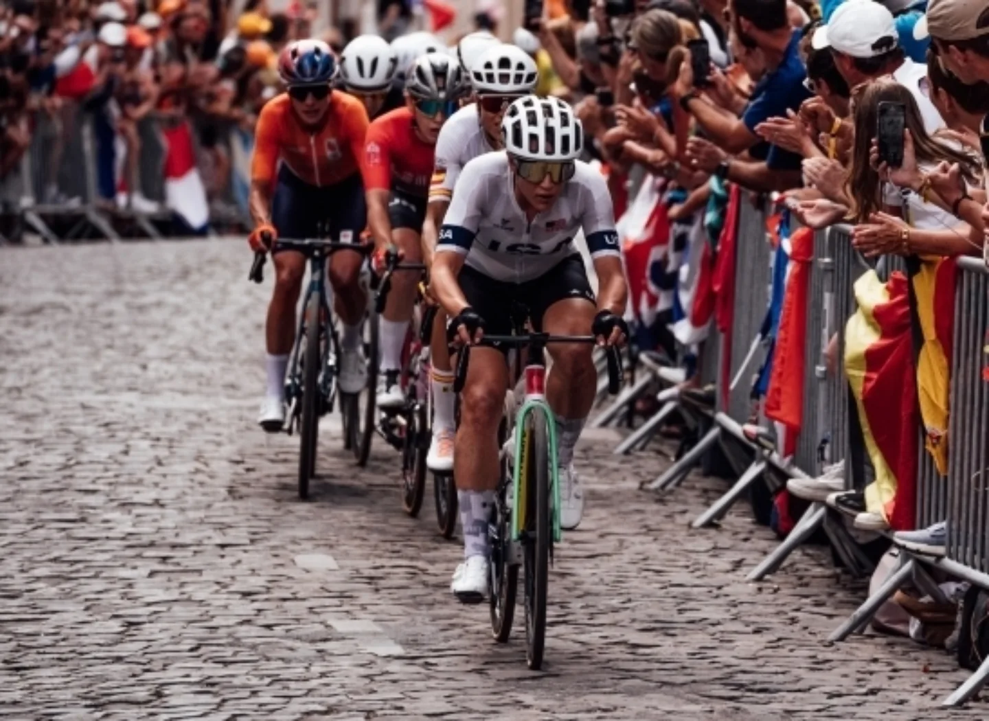 Road cyclists on cobbles