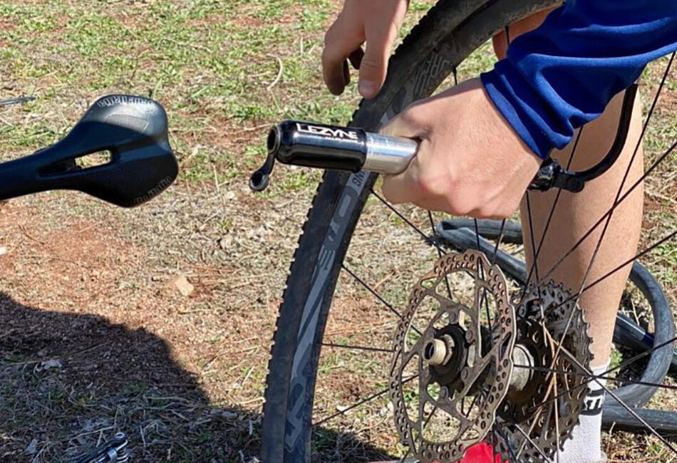 Pumping up a bike tire.